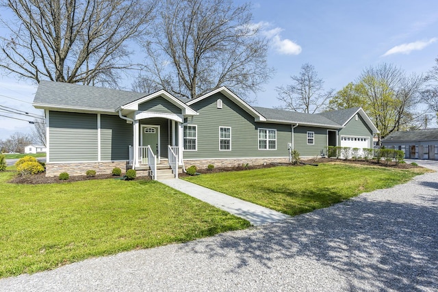 ranch-style home with stone siding and a front lawn