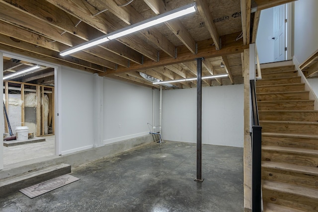 basement featuring stairs