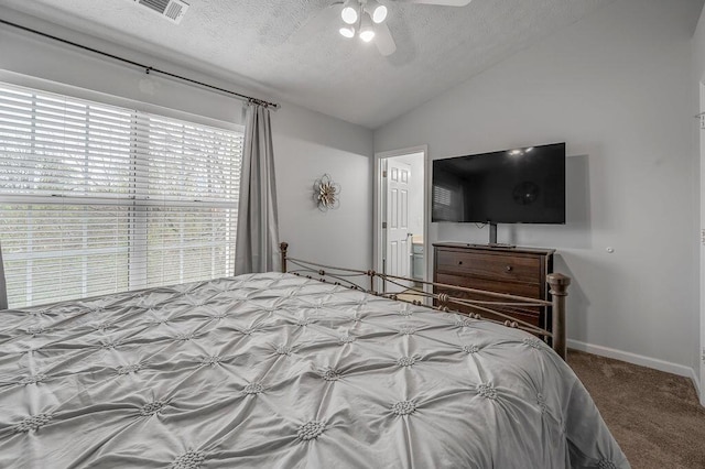 bedroom featuring a textured ceiling, visible vents, vaulted ceiling, carpet flooring, and baseboards