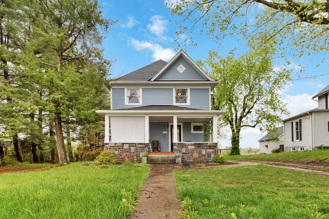 309 W Columbia St, Somerset, KY 42501 - american foursquare style home with a shingled roof, a porch, stone siding, and a front lawn