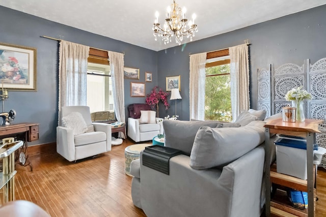 309 W Columbia St, Somerset, KY 42501 - living area featuring an inviting chandelier, wood-type flooring, and baseboards