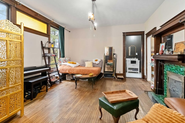 309 W Columbia St, Somerset, KY 42501 - bedroom featuring a tile fireplace and wood finished floors
