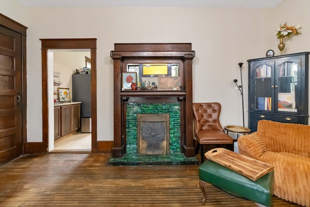 309 W Columbia St, Somerset, KY 42501 - living area featuring wood finished floors, a fireplace, and baseboards