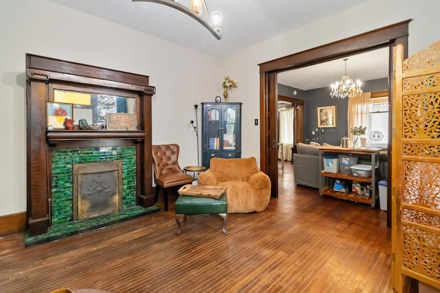 309 W Columbia St, Somerset, KY 42501 - sitting room featuring wood finished floors, an inviting chandelier, and a fireplace