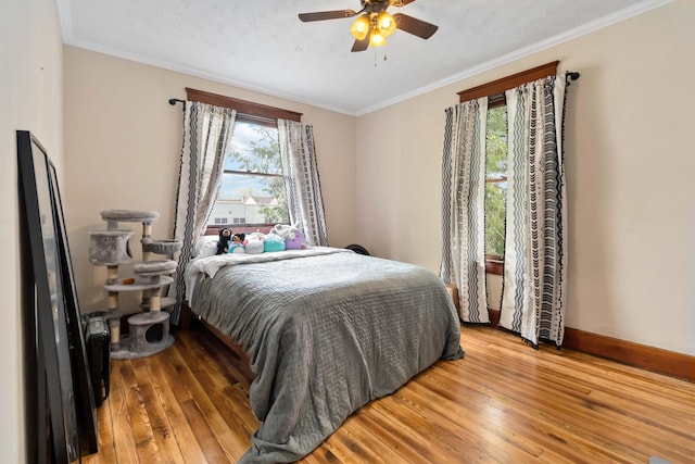 309 W Columbia St, Somerset, KY 42501 - bedroom featuring crown molding, wood-type flooring, baseboards, and ceiling fan