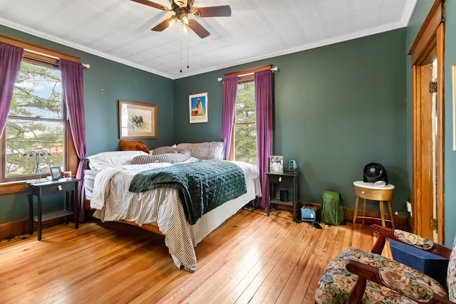 309 W Columbia St, Somerset, KY 42501 - bedroom with light wood-style flooring, crown molding, baseboards, and multiple windows