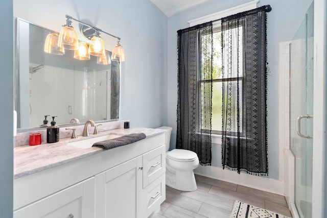 309 W Columbia St, Somerset, KY 42501 - full bath with a shower stall, vanity, a notable chandelier, and toilet