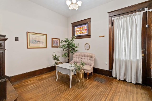 309 W Columbia St, Somerset, KY 42501 - living area with baseboards, a chandelier, and wood finished floors