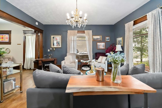 309 W Columbia St, Somerset, KY 42501 - living room with a notable chandelier and wood finished floors
