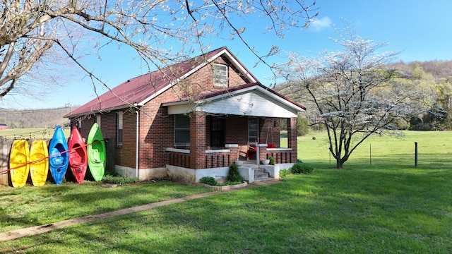 3473 Grundy Rd, Somerset, KY 42501 - bungalow-style home with brick siding, a porch, and a front yard