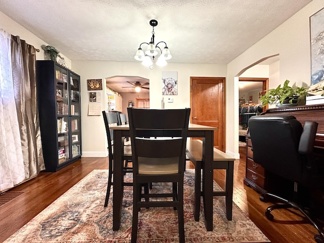 3473 Grundy Rd, Somerset, KY 42501 - dining room featuring a chandelier, dark wood-style floors, a textured ceiling, and ceiling fan