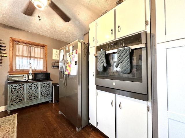 3473 Grundy Rd, Somerset, KY 42501 - kitchen with appliances with stainless steel finishes, ceiling fan, dark wood-style flooring, a textured ceiling, and white cabinetry