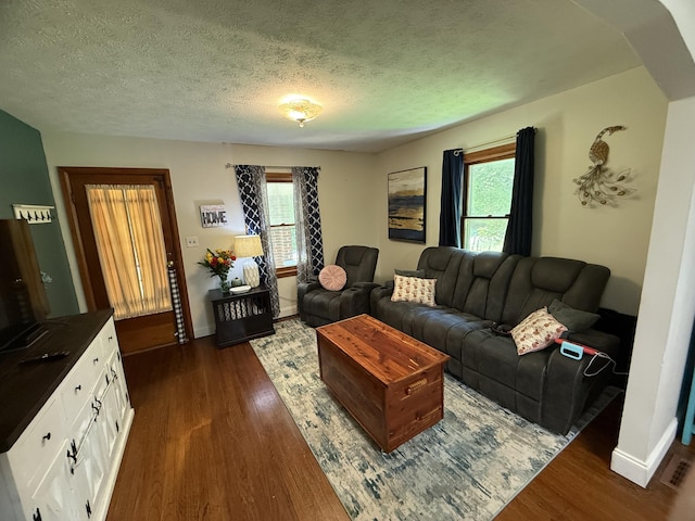 3473 Grundy Rd, Somerset, KY 42501 - living area with dark wood finished floors, a textured ceiling, and baseboards