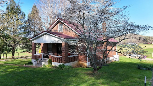 3473 Grundy Rd, Somerset, KY 42501 - view of front of property featuring brick siding, a porch, and a front lawn