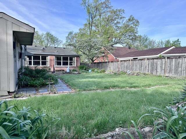 view of yard featuring a fenced backyard