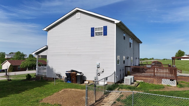305 Saddle Wood Ct, Berea, KY 40403 - view of side of home featuring fence private yard, a wooden deck, a yard, and central air condition unit