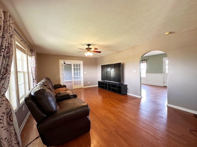 305 Saddle Wood Ct, Berea, KY 40403 - living room with arched walkways, wood finished floors, baseboards, a ceiling fan, and a textured ceiling