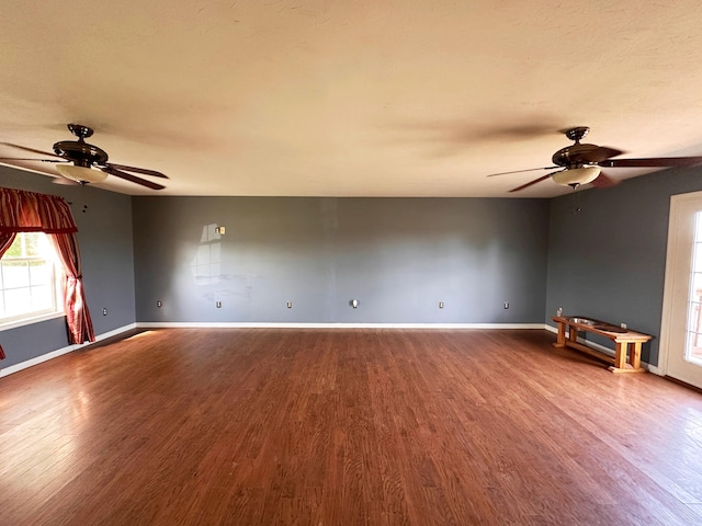 305 Saddle Wood Ct, Berea, KY 40403 - unfurnished room with wood finished floors, a ceiling fan, and baseboards