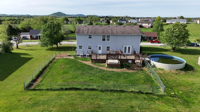 305 Saddle Wood Ct, Berea, KY 40403 - rear view of property featuring a deck, a yard, a residential view, and a fenced backyard