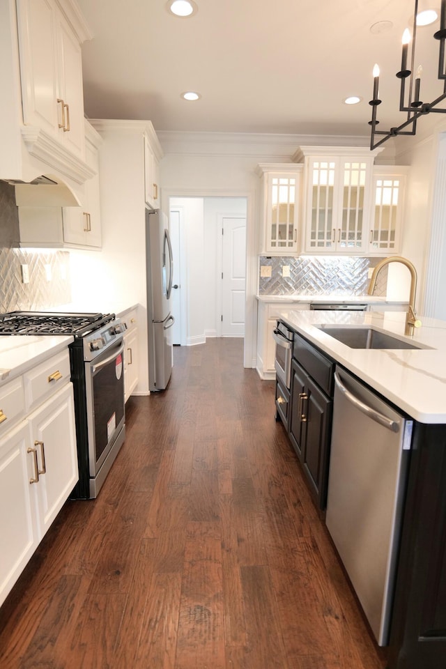 2524 Pascoli Pl, Lexington, KY 40509 - kitchen with appliances with stainless steel finishes, a sink, white cabinets, crown molding, and recessed lighting