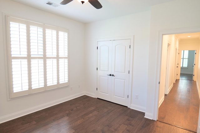 2524 Pascoli Pl, Lexington, KY 40509 - unfurnished bedroom featuring dark wood finished floors, baseboards, a closet, and a ceiling fan