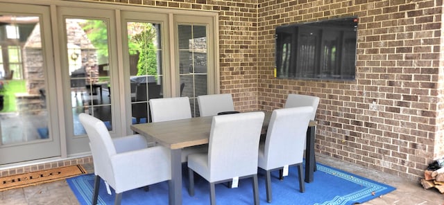 2524 Pascoli Pl, Lexington, KY 40509 - dining space featuring brick wall