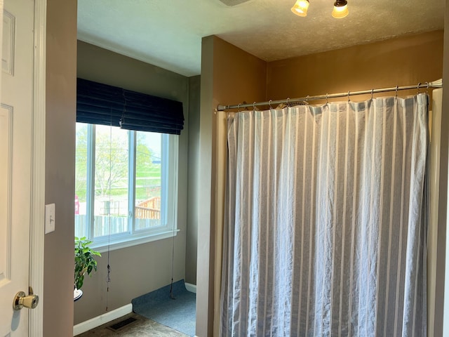 111 Keystone Dr, Richmond, KY 40475 - bathroom featuring visible vents, baseboards, and curtained shower