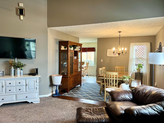 111 Keystone Dr, Richmond, KY 40475 - living room with baseboards, a textured ceiling, and an inviting chandelier