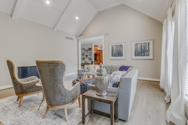 interior space with wood finished floors, baseboards, and visible vents