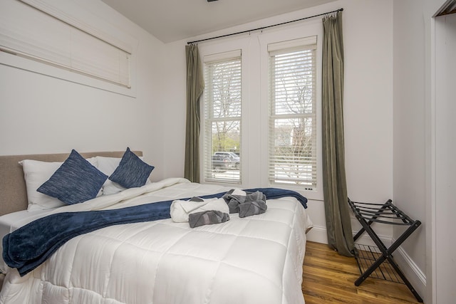 bedroom with wood finished floors