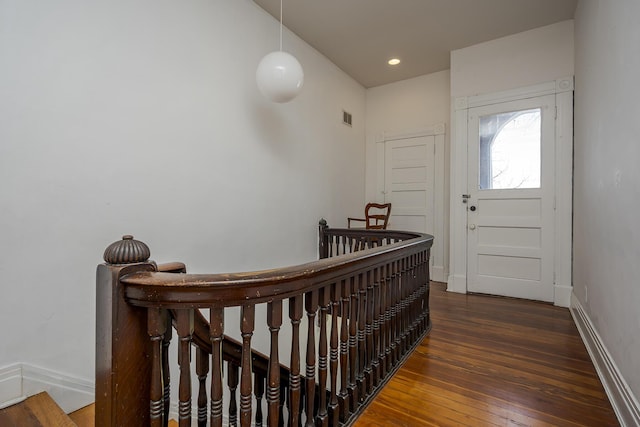 interior space featuring recessed lighting, wood-type flooring, visible vents, and baseboards