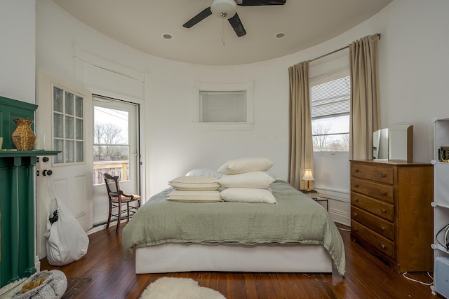 bedroom with a ceiling fan and dark wood finished floors