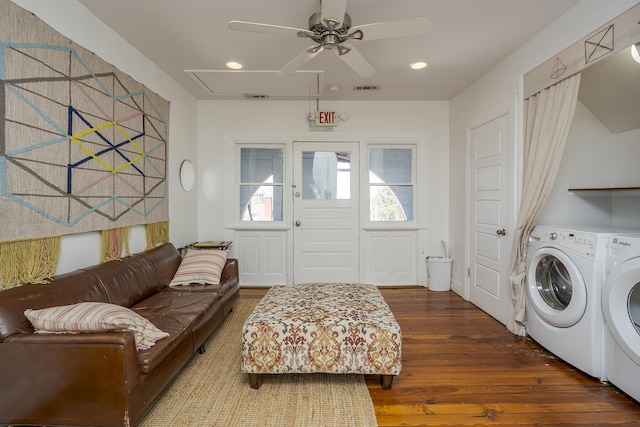 clothes washing area featuring attic access, visible vents, ceiling fan, washing machine and clothes dryer, and wood finished floors