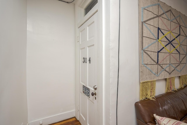 interior space featuring baseboards