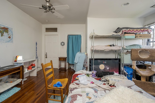 bedroom featuring wood finished floors and ceiling fan
