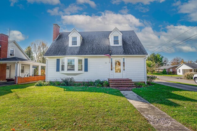 5 Bath Ave, Owingsville, KY 40360 - view of front of home with a shingled roof, a chimney, and a front lawn
