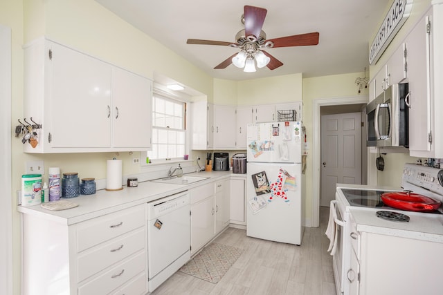 5 Bath Ave, Owingsville, KY 40360 - kitchen with a sink, a ceiling fan, white appliances, and white cabinetry