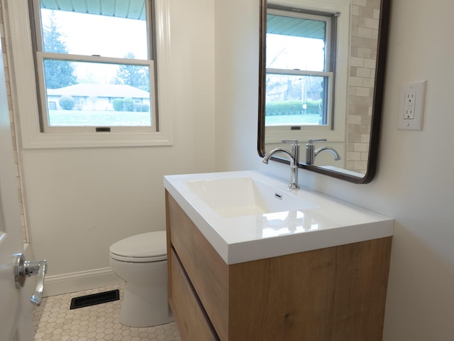 748 Wellington Way, Lexington, KY 40503 - bathroom with vanity, baseboards, tile patterned floors, toilet, and visible vents