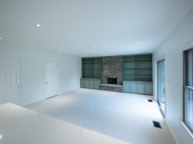 748 Wellington Way, Lexington, KY 40503 - unfurnished living room with built in shelves, baseboards, carpet, a fireplace, and recessed lighting