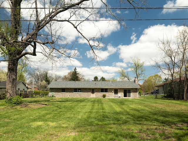 748 Wellington Way, Lexington, KY 40503 - rear view of property featuring a yard, fence, and a chimney