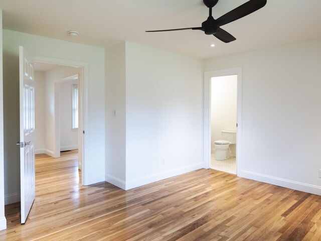 748 Wellington Way, Lexington, KY 40503 - unfurnished room with light wood-type flooring, a ceiling fan, and baseboards
