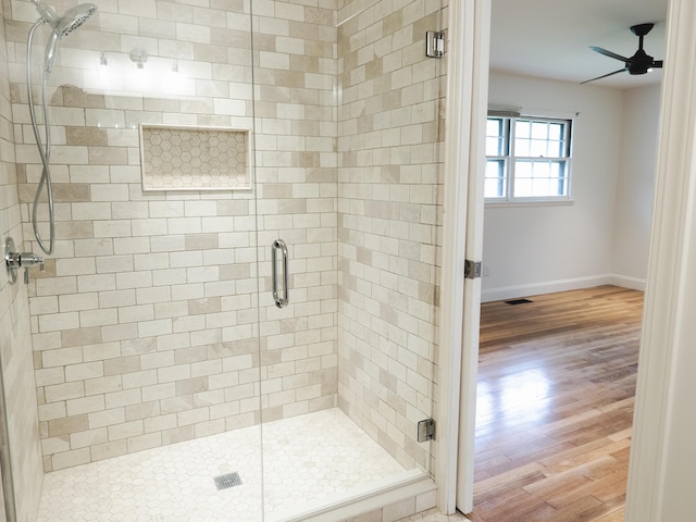 748 Wellington Way, Lexington, KY 40503 - full bath with baseboards, a ceiling fan, a shower stall, visible vents, and wood finished floors
