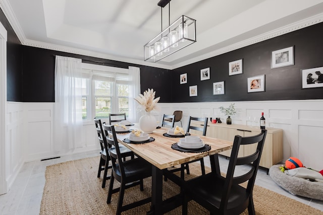 211 Eric Dr, Richmond, KY 40475 - dining room with wainscoting, a decorative wall, and crown molding