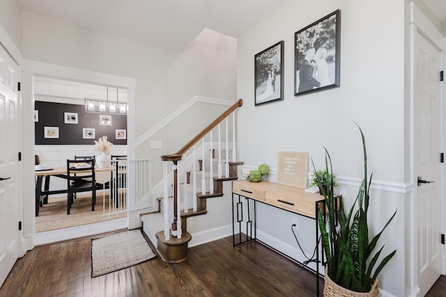 211 Eric Dr, Richmond, KY 40475 - foyer entrance featuring baseboards, a chandelier, stairway, and dark wood finished floors