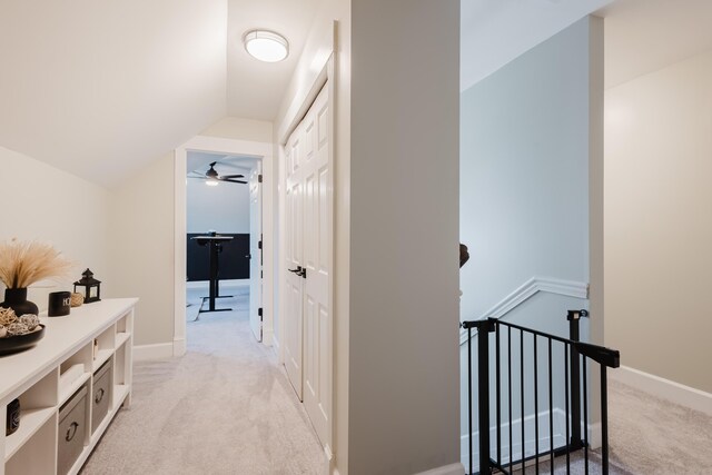 211 Eric Dr, Richmond, KY 40475 - hall featuring lofted ceiling, baseboards, an upstairs landing, and light colored carpet