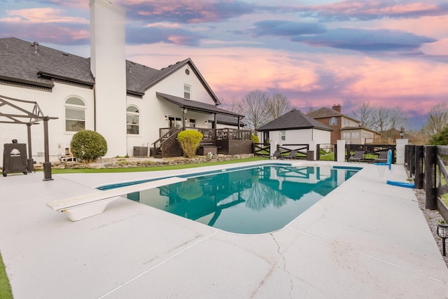 211 Eric Dr, Richmond, KY 40475 - view of swimming pool featuring a fenced in pool, a wooden deck, stairs, an outdoor structure, and a patio
