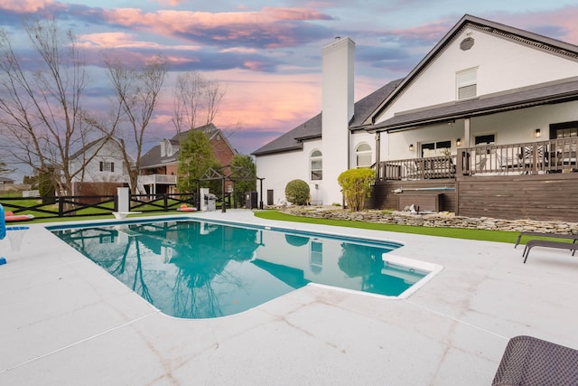 211 Eric Dr, Richmond, KY 40475 - pool at dusk featuring fence, a fenced in pool, and a patio