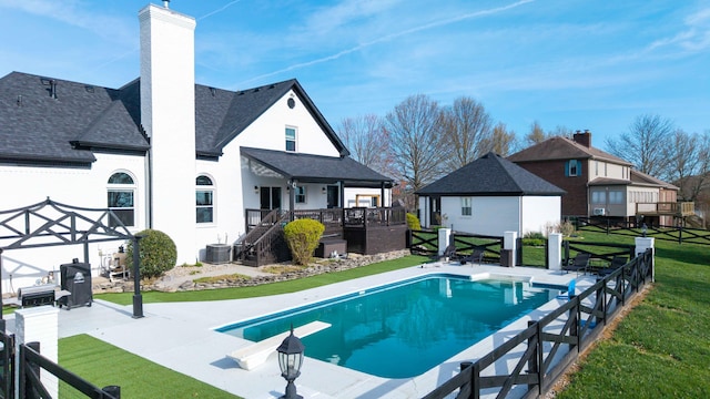 211 Eric Dr, Richmond, KY 40475 - view of swimming pool featuring central air condition unit, a fenced in pool, a lawn, and a fenced backyard