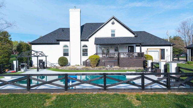 211 Eric Dr, Richmond, KY 40475 - back of property featuring a patio area, a chimney, fence, a fenced in pool, and roof with shingles