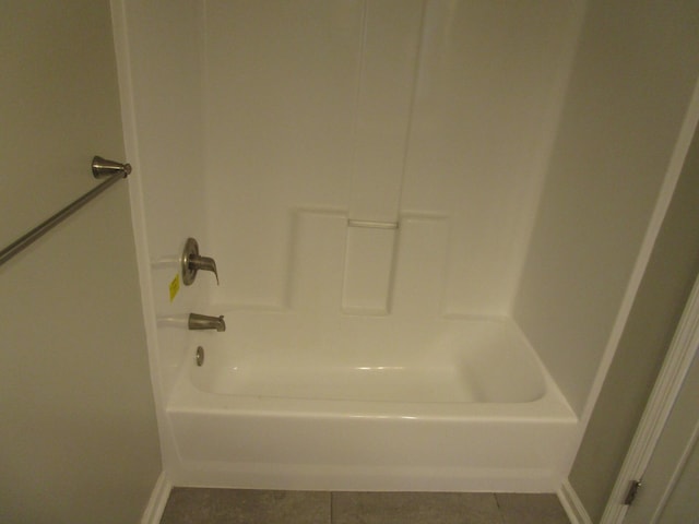bathroom featuring tile patterned flooring and baseboards